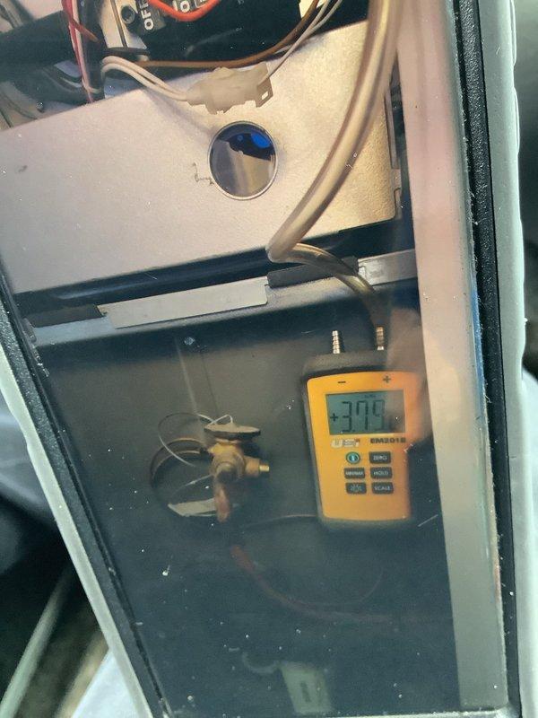 Conducted routine heating system maintenance on 10-year-old BS-MVP unit. Inspected refrigerant lines and coils, and performed temperature readings using UEI gauge, which displayed -37.9°F. Service was originally scheduled as recurring maintenance but was rescheduled from previous date.