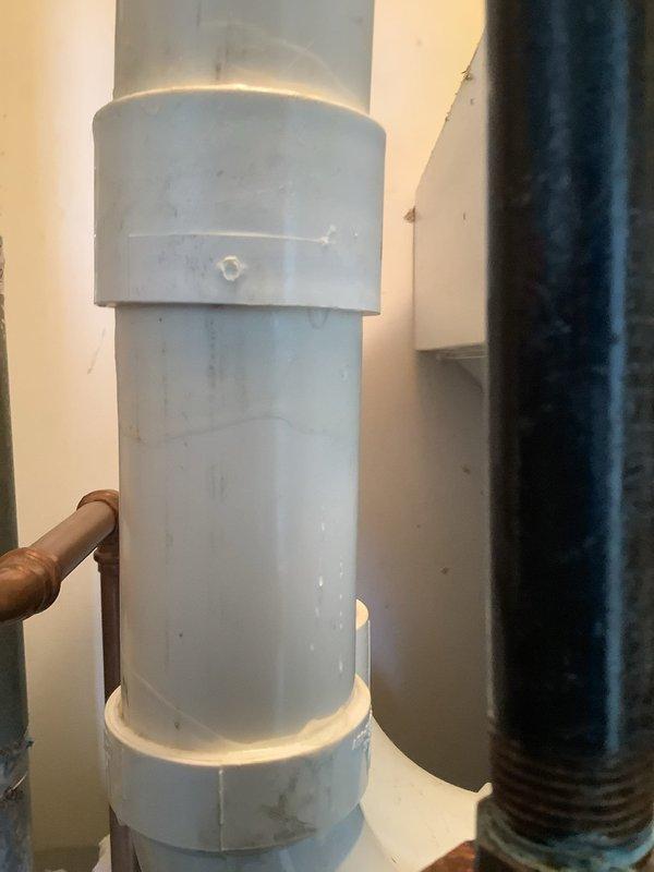 Replaced leaking section of PVC condensate drain pipe on HVAC system as previously diagnosed. Installed new couplings at connection points to ensure proper drainage and prevent future leakage. System is now functioning properly with no signs of water leakage.