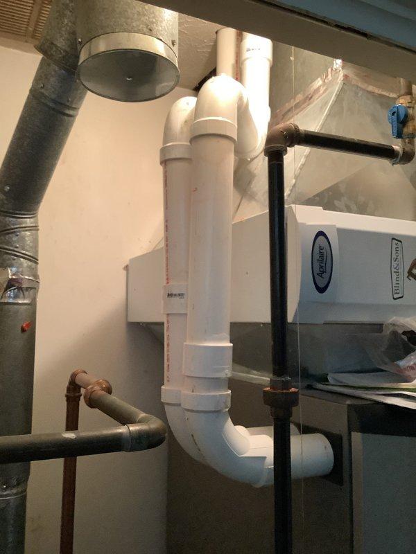 Replaced leaking section of PVC condensate drain pipe on HVAC system as previously diagnosed. Installed new couplings at connection points to ensure proper drainage and prevent future leakage. System is now functioning properly with no signs of water leakage.
