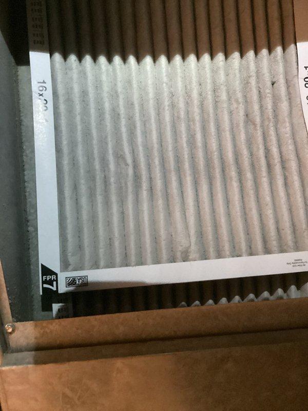 Performed scheduled maintenance on furnace system, including inspection of air handler components and motor assembly. Noted moderate dust accumulation on pleated air filter requiring replacement. All electrical connections were verified secure with proper wire routing to fan motor.