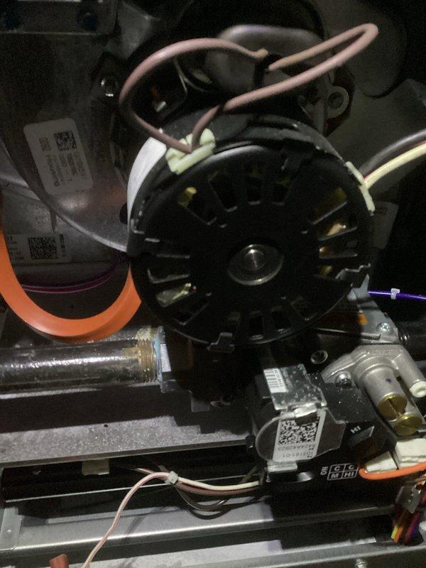 Performed scheduled maintenance on furnace system, including inspection of air handler components and motor assembly. Noted moderate dust accumulation on pleated air filter requiring replacement. All electrical connections were verified secure with proper wire routing to fan motor.