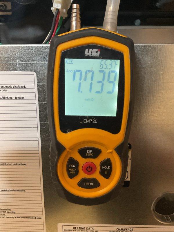 Completed routine heating maintenance on 5-year-old system. Inspected gas line connections and found minor corrosion at threaded union fitting. Performed pressure testing with manometer, confirming proper gas pressure at 0.039 inH2O with system temperature at 65.7°F, all within manufacturer specifications.