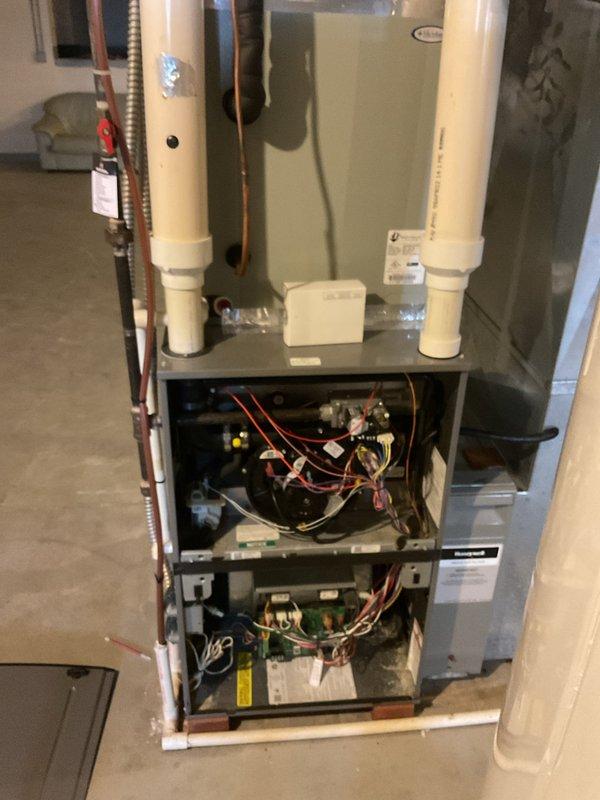 Performed annual maintenance service on an approximately 10-year-old furnace. Inspected and documented condition of filter housing, evaporator coil access, and internal components. Removed front panel to examine electrical connections, circuit boards, and mechanical systems. Unit is functioning properly with no immediate issues identified.