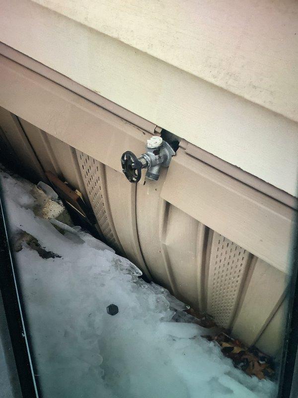 Performed scheduled maintenance on furnace system including replacement of air filter and chemical cleaning of blower wheel to improve airflow efficiency throughout the home. Inspected exterior plumbing fixtures and noted some corrosion and mineral buildup on valve components with possible previous moisture issues, as well as examined outdoor spigot condition during winter conditions.
