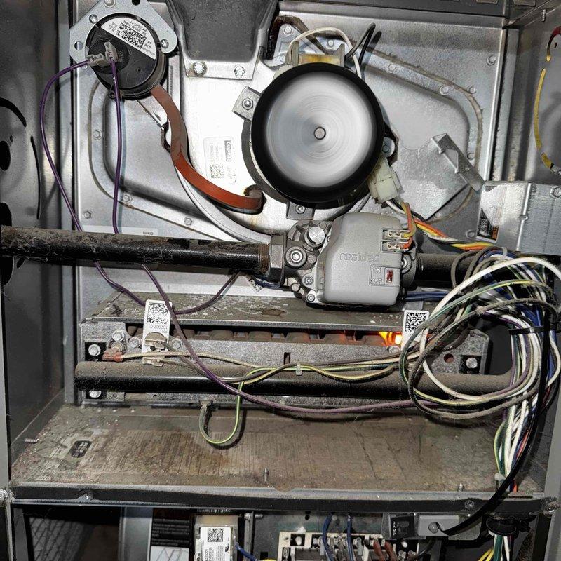 Diagnosed and serviced a 4-year-old non-operational furnace, identifying issues with the blower motor assembly and wiring connections. Removed accumulated debris, tightened loose electrical connections in the control board, and realigned the fan assembly to restore proper functionality.