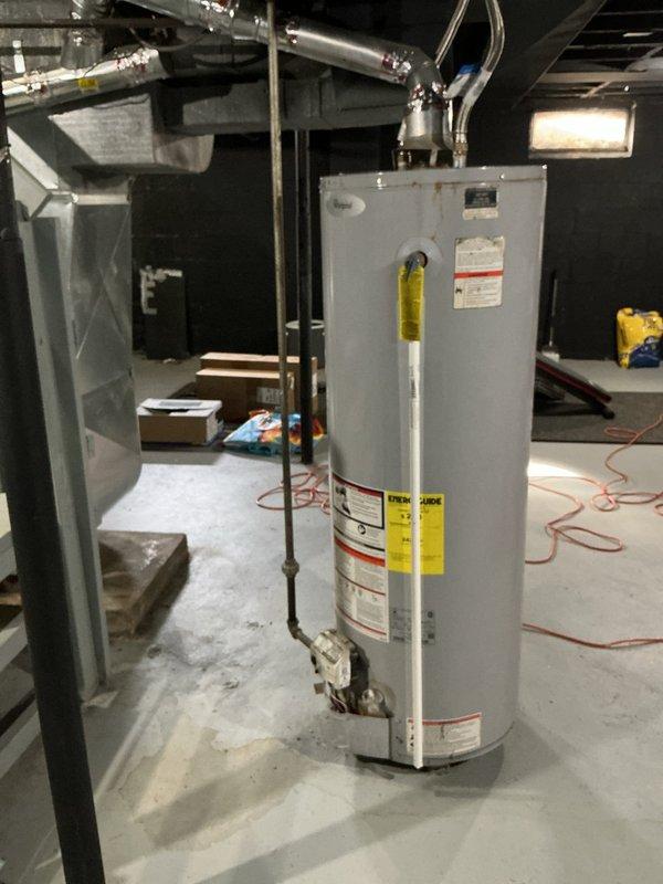 Responded to service call for non-functioning tanked water heater in 80-year-old home. Inspected unit, which showed proper connection of stainless steel flexible connectors and adequately sealed pipe joints. Identified and resolved operational issues, ensuring proper ventilation through the existing metal ductwork, and restored hot water functionality to the system.