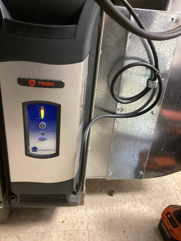 Responded to service call for Trane CleanEffects air filtration system showing multiple indicator lights (red, yellow, and green). Performed diagnostic check on the system, inspected all connections between the filtration unit and the main furnace, and reset the filter monitoring system. Restored proper functionality to the CleanEffects unit, eliminating error indicators and ensuring optimal air purification performance.
