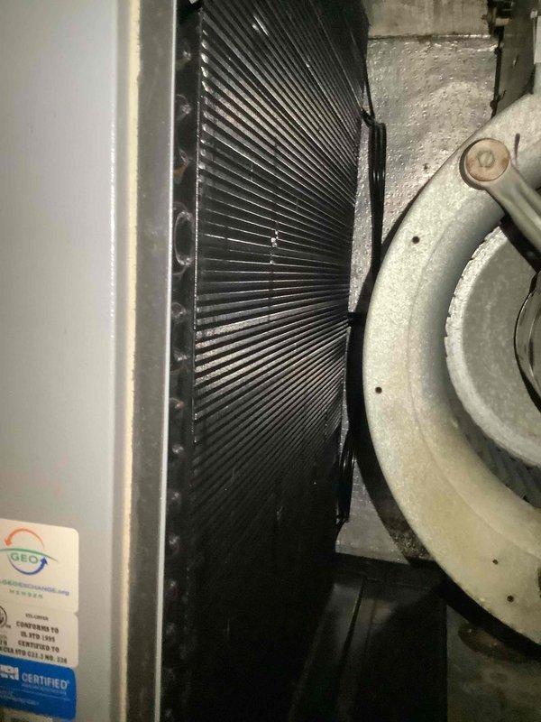 Performed routine cooling maintenance on 1.5-year-old HVAC system for MVP member. Inspected heat exchanger fins and found them in good condition with no visible damage. Examined refrigerant lines, electrical connections, and system components which appeared operational with normal dust accumulation but no significant corrosion or damage.