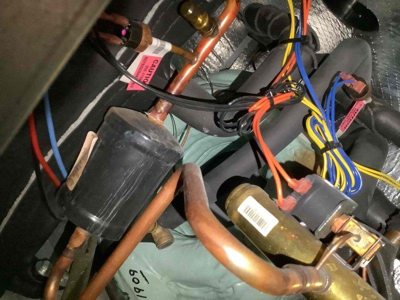 Performed routine cooling maintenance on 1.5-year-old HVAC system for MVP member. Inspected heat exchanger fins and found them in good condition with no visible damage. Examined refrigerant lines, electrical connections, and system components which appeared operational with normal dust accumulation but no significant corrosion or damage.