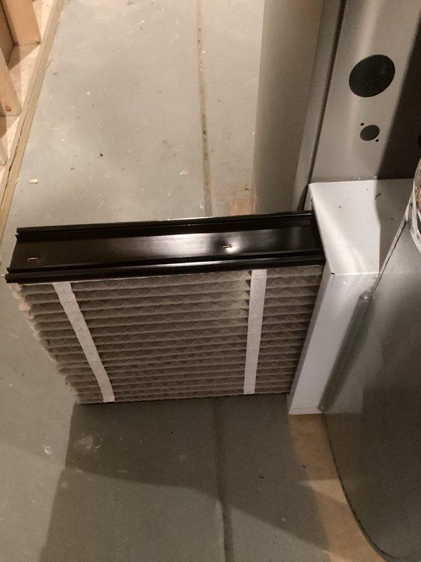 Performed scheduled heating maintenance service on a water heater system. Inspected and verified condition of the unit, including PVC venting and connections. Examined and confirmed proper installation of the air filter in the HVAC system, noting clean pleated filter material with intact frame and strapping.