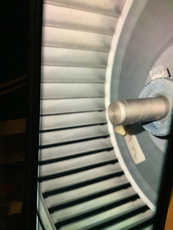Performed scheduled heating system maintenance, inspecting the blower wheel assembly and evaporator coil. Documented condition of fan components and heat exchanger fins, noting some normal wear and possible buildup on components that may require attention at next service interval.