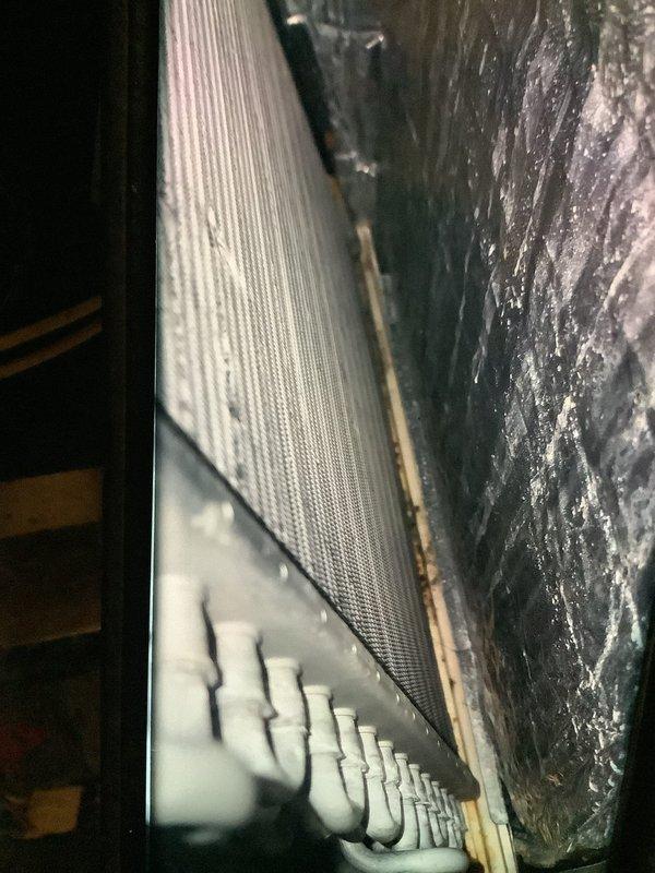 Performed scheduled heating system maintenance, inspecting the blower wheel assembly and evaporator coil. Documented condition of fan components and heat exchanger fins, noting some normal wear and possible buildup on components that may require attention at next service interval.