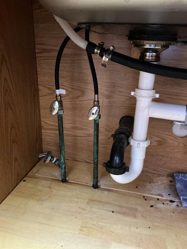 Successfully replaced customer-supplied kitchen faucet with new mounting hardware and shutoff valves. Installed new InSinkErator 3/4 HP garbage disposal with quiet technology to replace aging unit. All connections tested and functioning properly with no leaks.