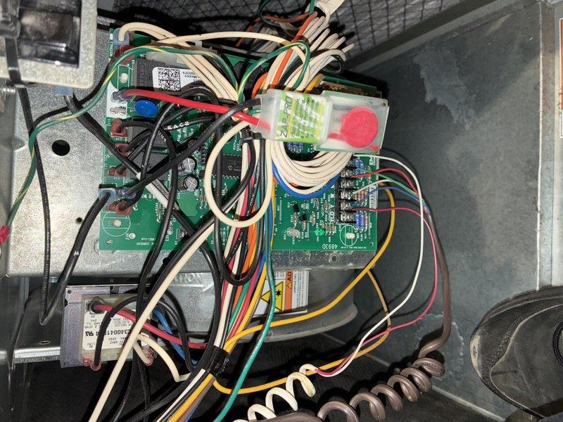 Performed scheduled maintenance on an 11-year-old heating system with unknown manufacturer. Inspected and documented heavily soiled air filter requiring replacement. Examined control board and electrical connections, finding all components and wiring harness in functional condition with no visible damage or loose connections.