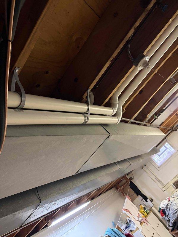 Installed proper support brackets for HVAC vent and intake pipes as required by inspection standards. Added protective screens to vent and intake discharge pipes to prevent debris entry while maintaining proper airflow, bringing installation into compliance with code requirements.