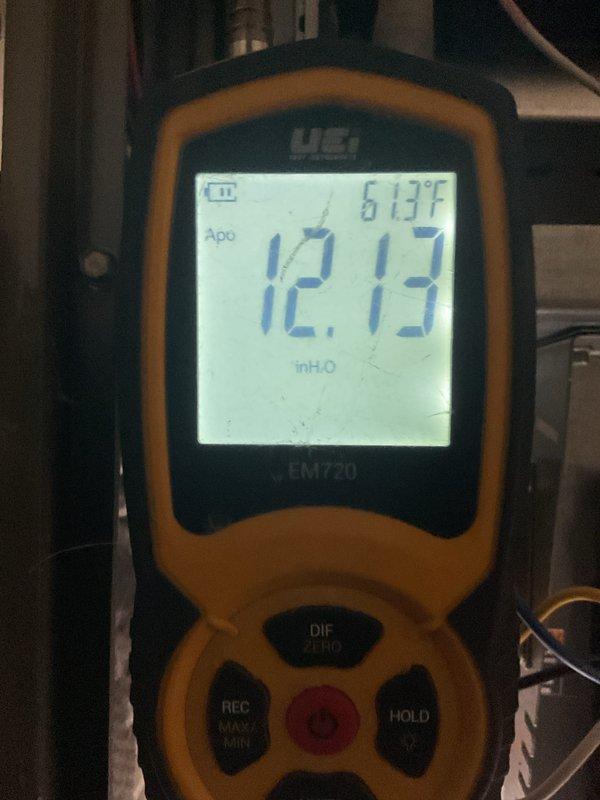 Performed scheduled MVP heating maintenance service. Conducted pressure testing of system with UEi EM720 instrument, measuring 12.13 inH2O at 61.3°F. Used hex key tool for adjustment and access to internal components during the comprehensive inspection.