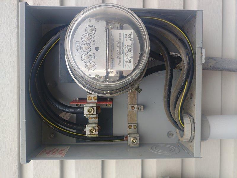 Responded to service call regarding whole-house light flickering. Visual inspection revealed tension on the service line due to house settling, confirmed by examination of the meter box connections and exterior service entrance. Identified and documented potential stress points where cables enter the building near the plumbing infrastructure.