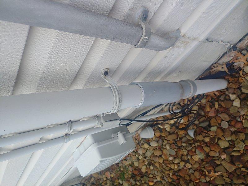 Responded to service call regarding whole-house light flickering. Visual inspection revealed tension on the service line due to house settling, confirmed by examination of the meter box connections and exterior service entrance. Identified and documented potential stress points where cables enter the building near the plumbing infrastructure.