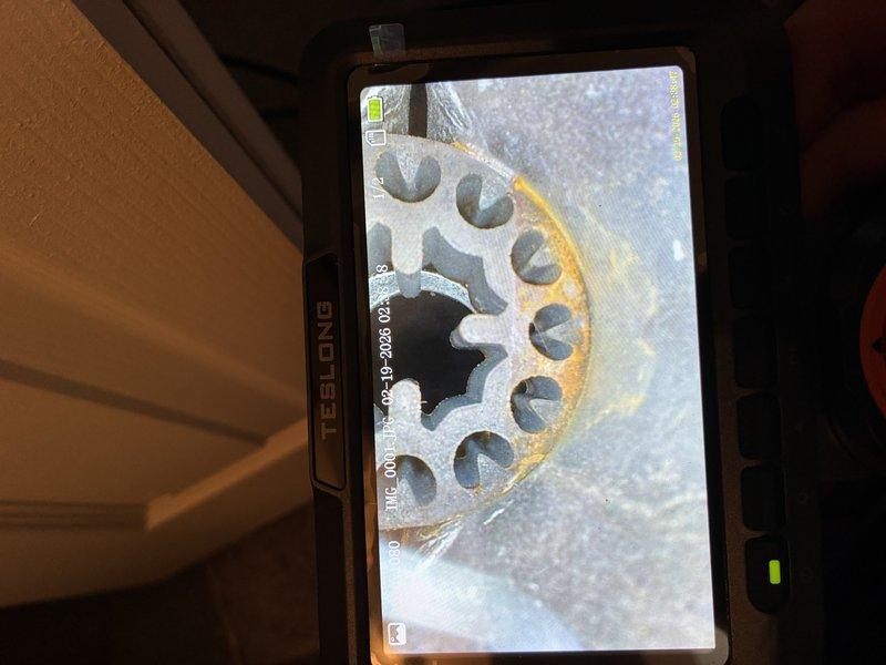 Performed routine maintenance on a 2.5-year-old furnace. Conducted visual inspection using TESLONG camera, revealing early-stage corrosion on gear assembly. Examined flame sensor which showed proper installation but minor buildup requiring cleaning. System now operating at optimal efficiency.