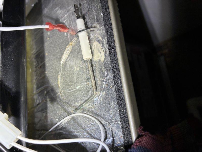 Performed routine maintenance on a 2.5-year-old furnace. Conducted visual inspection using TESLONG camera, revealing early-stage corrosion on gear assembly. Examined flame sensor which showed proper installation but minor buildup requiring cleaning. System now operating at optimal efficiency.