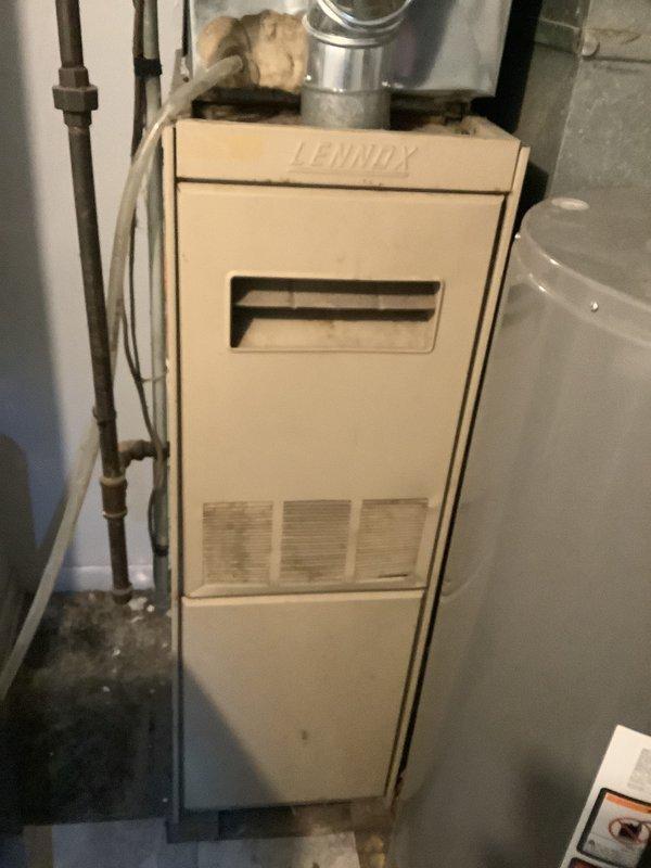 Successfully removed and reinstalled water heater to accommodate new Lennox furnace installation. Positioned furnace on elevated box platform with integrated air cleaner installed underneath unit. Completed all necessary ductwork connections and verified proper system operation.