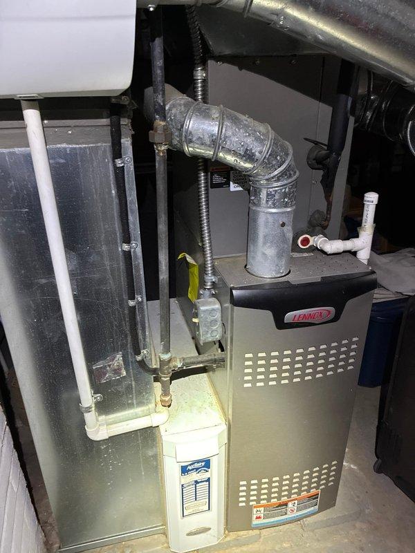 Performed scheduled MVP maintenance service on Lennox furnace system. Inspected complete system including ductwork, PVC venting, and electrical connections, finding all components in functional condition. Replaced dirty accordion-style filter elements to ensure optimal system efficiency and airflow.