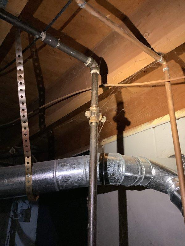 Responded to service call regarding garbage disposal replacement. Upon inspection of the plumbing infrastructure in the attic/crawl space and basement area, observed properly functioning PVC drain lines and copper supply piping with no signs of leakage. Customer previously declined sump pump replacement but has now requested installation service; coordinated with electrician for follow-up work.