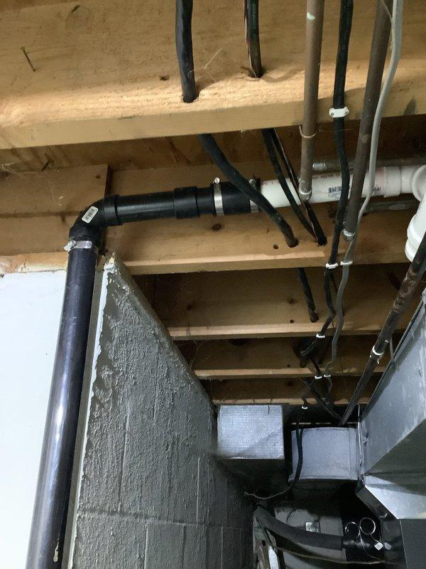 Responded to service call regarding garbage disposal replacement. Upon inspection of the plumbing infrastructure in the attic/crawl space and basement area, observed properly functioning PVC drain lines and copper supply piping with no signs of leakage. Customer previously declined sump pump replacement but has now requested installation service; coordinated with electrician for follow-up work.