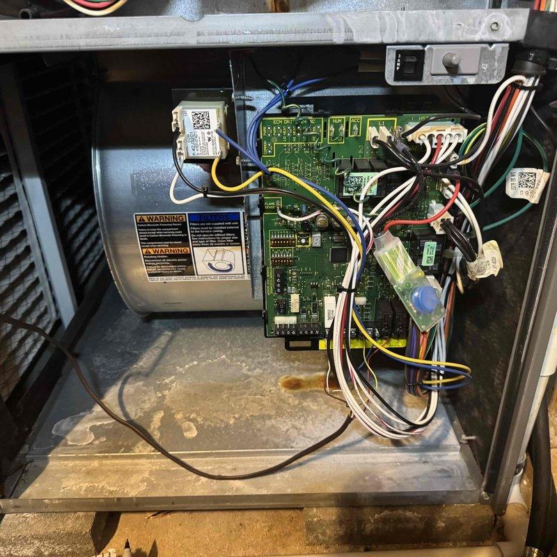 Performed scheduled MVP heating maintenance service on two units. Inspected the control board connections and wiring, noting proper connections between the circuit board and various components. Examined the blower wheel assembly which showed normal condition with no significant dust accumulation or damage, ensuring optimal airflow performance.