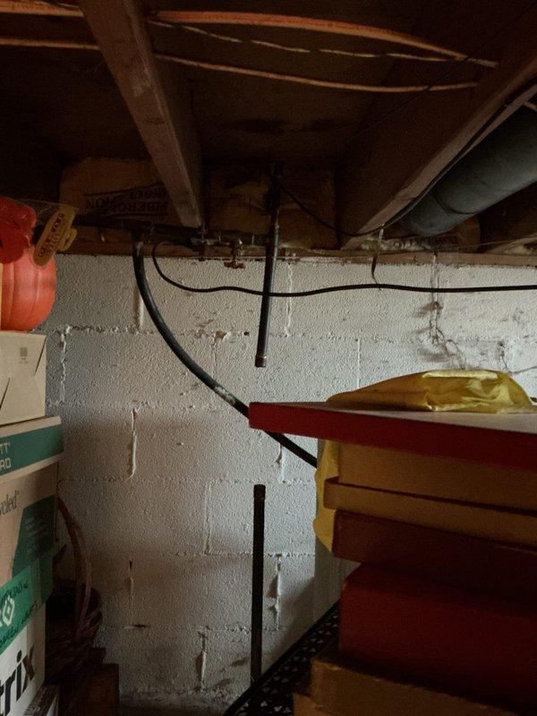 Performed inspection of six shut-off valves in basement area with concrete block walls. Identified aging copper supply piping with outdated valve hardware requiring replacement. Documented current installation configuration to prepare comprehensive quote for valve replacement as requested by customer.