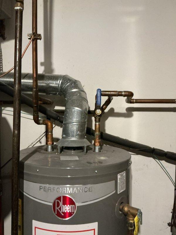 Completed a water heater replacement, removing the leaking 2016 Rheem 40-gallon unit and installing a new Bradford White 50-gallon water heater with 8-year manufacturer warranty. Rebuilt the cold water line to accommodate a new shut-off valve and expansion tank, bonded the hot and cold water lines, updated the drain pan, and replaced an existing saddle valve with a proper tee and shut-off valve.
