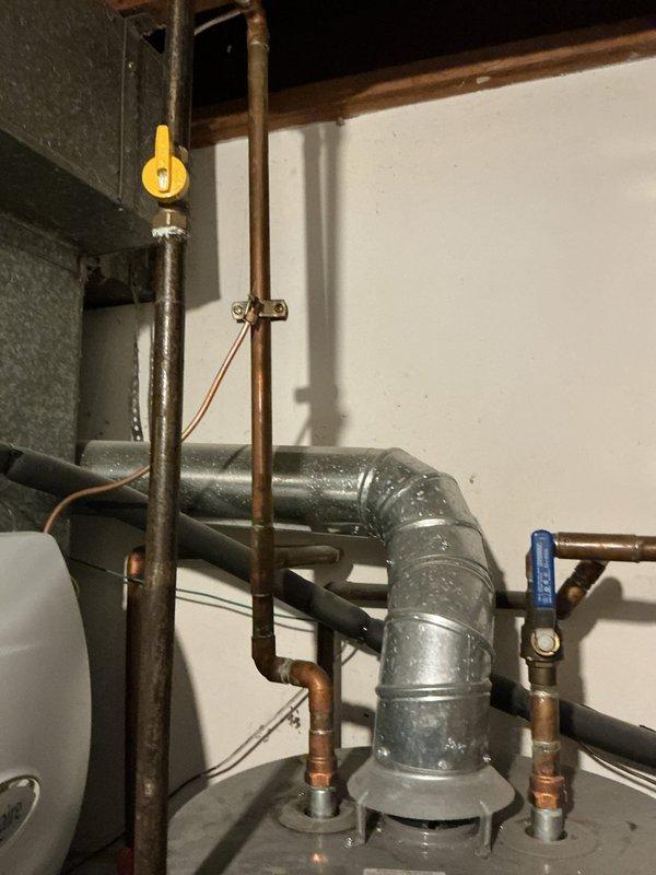 Completed a water heater replacement, removing the leaking 2016 Rheem 40-gallon unit and installing a new Bradford White 50-gallon water heater with 8-year manufacturer warranty. Rebuilt the cold water line to accommodate a new shut-off valve and expansion tank, bonded the hot and cold water lines, updated the drain pan, and replaced an existing saddle valve with a proper tee and shut-off valve.