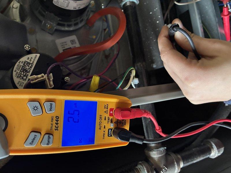 Responded to no-heat call for a newer heating system installed in 2023. Diagnostic testing with Fieldpiece SC440 multimeter revealed low voltage readings (16V and 23.3V) at control board connections. Identified and replaced faulty control board transformer, restoring proper system voltage and heating function.