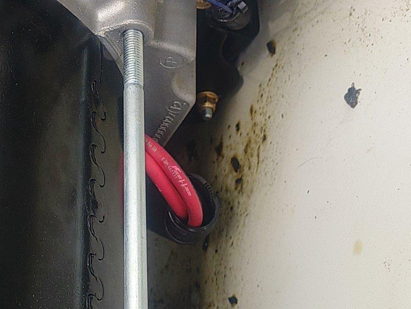 Inspected generator after previous technician noted oil accumulation at bottom of unit. Documented evidence of potential oil leak with photographs showing staining on housing surfaces and around connection points. Unit remains under warranty; case has been escalated for follow-up service within 1-5 day timeframe.