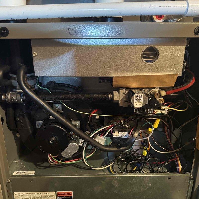 Performed MVP furnace tune-up on unit, including inspection of internal mechanical and electrical components. Discovered severe dust and lint accumulation on heat exchanger/filter requiring thorough cleaning to restore proper airflow and system efficiency. Completed preventive maintenance to ensure optimal heating performance.