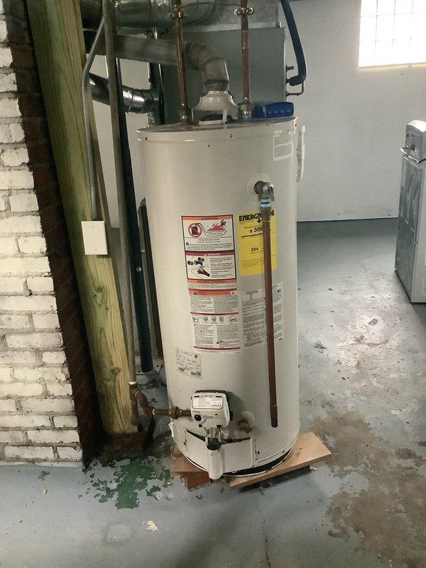 Responded to a water leak service call with water damage affecting multiple areas (bathroom, kitchen, and basement). Inspection revealed water staining around the kitchen sink cabinet and floor, with evidence of leakage from plumbing connections under the sink. Further investigation identified the water heater in the basement as the primary source, showing signs of discharge from the temperature/pressure relief valve with visible water stains on the concrete floor beneath the unit. Documented findings with photos and provided detailed explanation of cause to customer as requested.