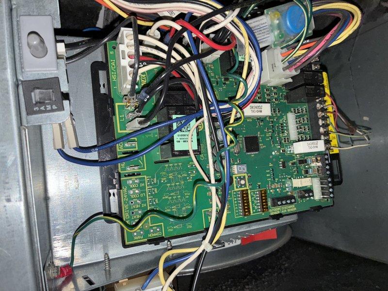 Performed routine maintenance on furnace in restricted access area. Inspected and cleaned control board connections and wiring harness, noting proper terminal connections. Cleaned accumulated dust from blower assembly and fan blades to ensure optimal airflow and system efficiency.