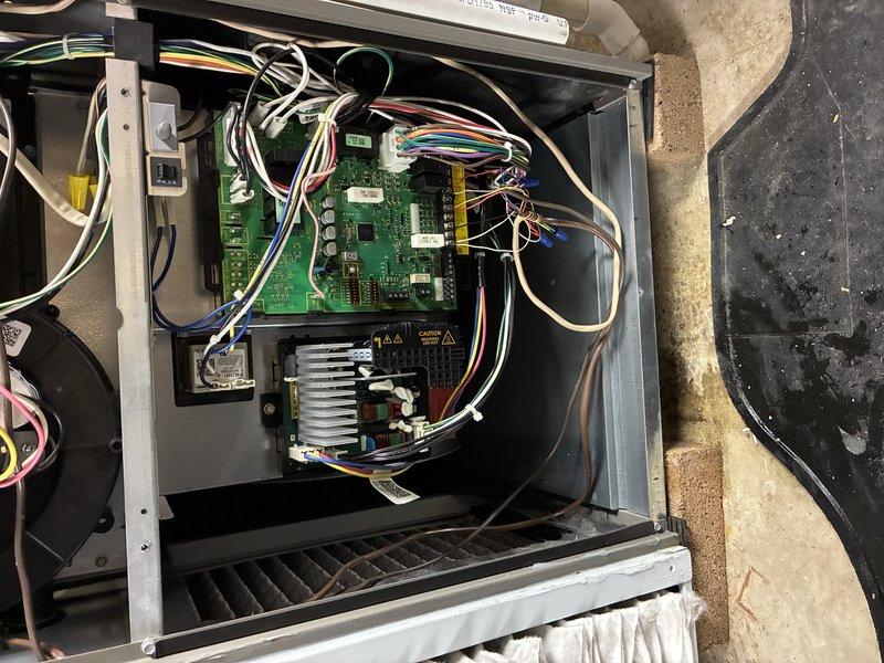 Performed scheduled preventive maintenance on HVAC heating system. Inspected control board and electrical components, noting normal wear with some dust accumulation on circuit boards and heat sink. Verified all wiring connections were secure and properly terminated with no signs of overheating or damage.