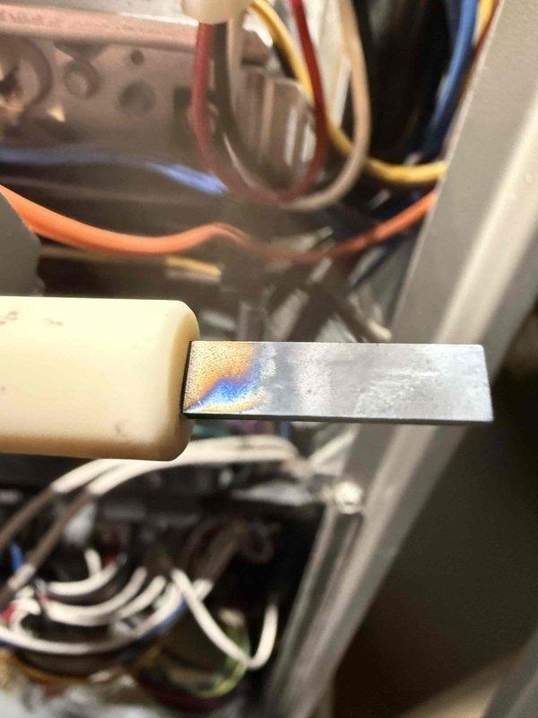 Performed routine maintenance visit on furnace system. Discovered signs of overheating at electrical terminal connections with visible heat discoloration on metal components. Identified and documented corrosion on heat exchanger tubing that will require monitoring during future service visits.
