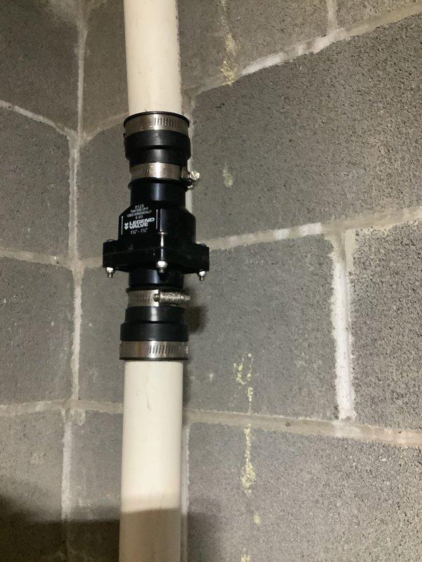 Responded to service call for sump pump water leakage issue. Upon inspection, discovered disconnected downspout causing water to back up into home. Installed new check valve on the PVC discharge pipe, secured with proper metal clamps and verified proper electrical connection to ensure system functionality. Reconnected downspout to complete repair and prevent further water intrusion.