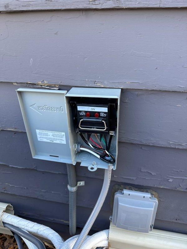 Upgraded electrical circuit for AC equipment to accommodate larger power requirements of new unit, as previous wiring was undersized. Reconnected all wiring to Diversitech control panel and verified proper operation of the system. Completed work includes proper conduit installation and connection to exterior-mounted junction box.