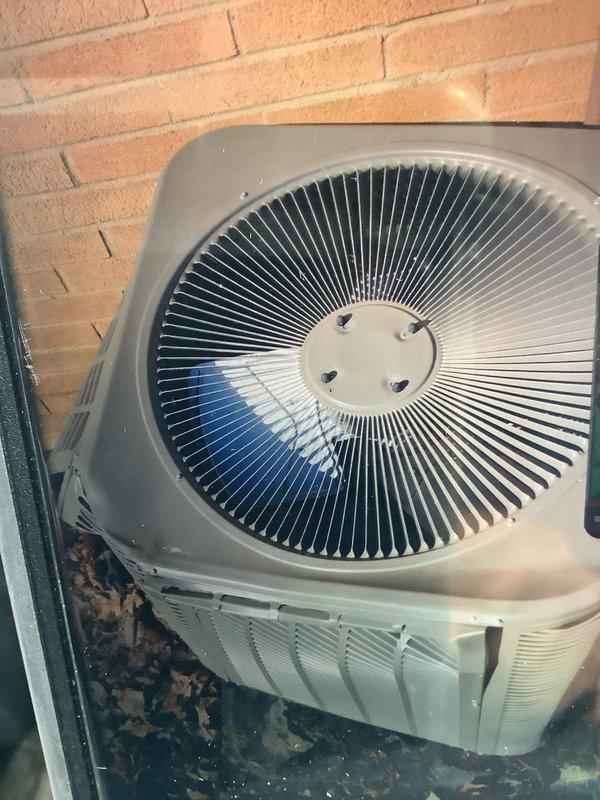 Responded to service call for A/C unit damaged by ice impact. Upon inspection, the 2-year-old condensing unit showed significant exterior damage to the housing, fan grill, and condenser coil. Replaced damaged components and verified proper system operation before completing service.
