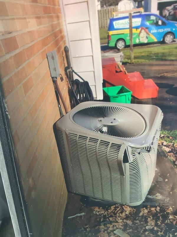 Responded to service call for A/C unit damaged by ice impact. Upon inspection, the 2-year-old condensing unit showed significant exterior damage to the housing, fan grill, and condenser coil. Replaced damaged components and verified proper system operation before completing service.