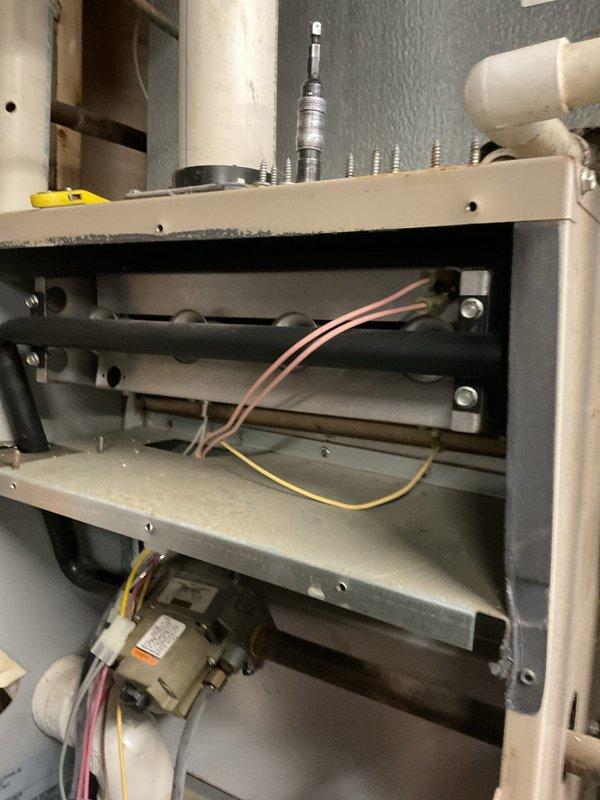 Diagnosed 22-year-old furnace with non-functional draft inducer motor, evidenced by disconnected wiring and improper operation. Replaced draft inducer assembly, reconnected all electrical components, and verified proper system operation through complete heating cycle test.