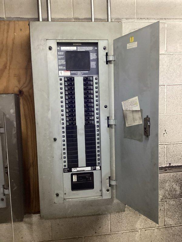 Installed new 240V outlet as requested and upgraded existing circuit breaker panel. Inspected Siemens panel mounted on concrete block wall, ensuring all connections were secure and properly labeled. System now functioning correctly with updated control box components.