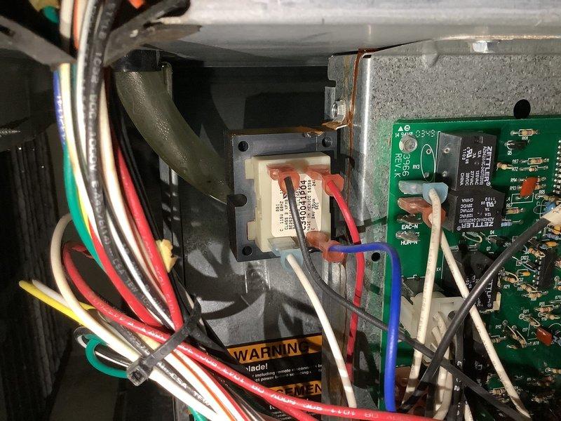 Responded to service call for furnace making abnormal noise. Upon inspection, found water damage and rust on blower motor housing causing vibration against the frame. Replaced ECM motor and inspected control board for potential electrical issues, confirming proper operation after installation.