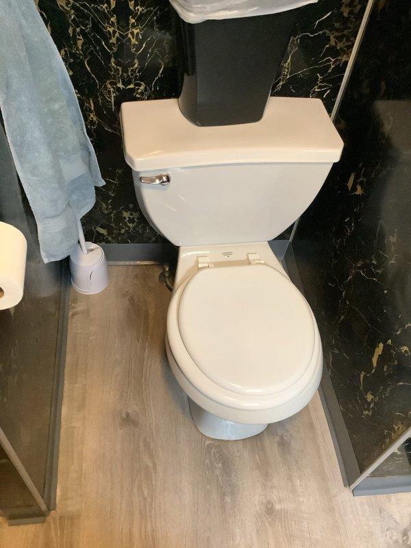 Successfully completed toilet pull and reset service with installation of new wax ring, bolts, and supply line. Toilet is now properly secured and functioning as intended with no leaks observed.