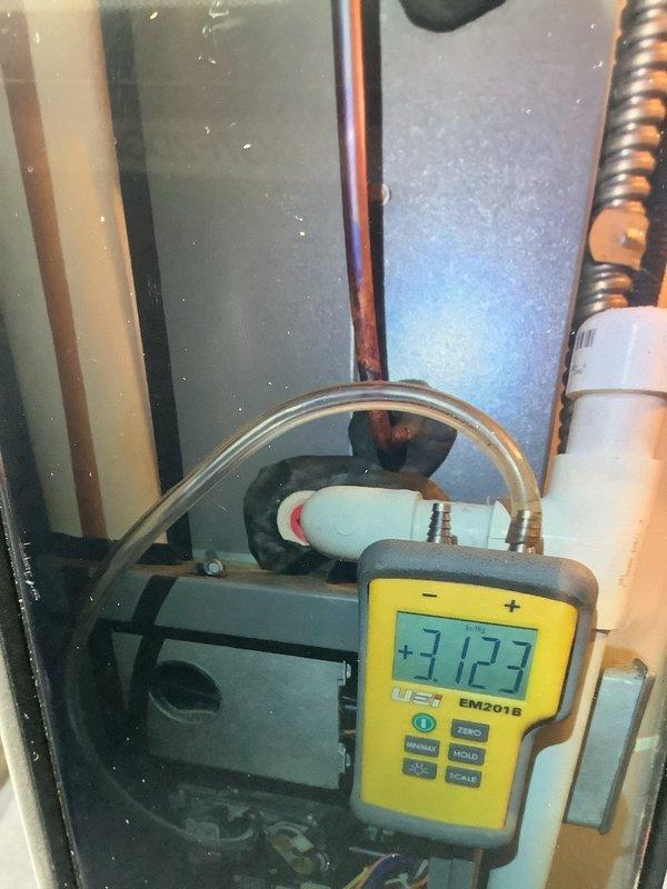 Performed comprehensive furnace tune-up including system inspection and operational testing. Evaluated Aprilaire humidity control system functionality and verified proper settings. Conducted gas pressure measurement with UEI EM201B digital manometer (reading 3.123) to ensure optimal combustion efficiency. Also inspected ductwork to assess cleaning requirements.
