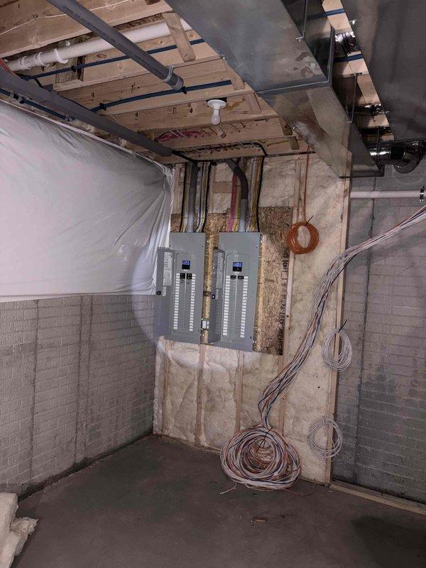 Performed on-site assessment for generator installation and gas line extension to fire pit. Inspected electrical service panels in unfinished basement to evaluate capacity and connection requirements. Documented current mechanical room configuration including existing HVAC, plumbing systems, and available utility space to determine optimal generator placement and connection points.