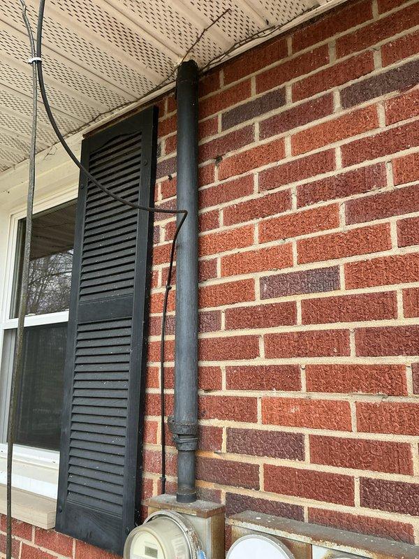 Conducted comprehensive assessment for electrical panel upgrade to 200 amp service and AC replacement. Inspection of existing electrical meter setup on brick exterior wall revealed need for updated service capacity to support new HVAC system. Documented current utility meter configuration and surrounding infrastructure to facilitate proper planning for the upgrade project.